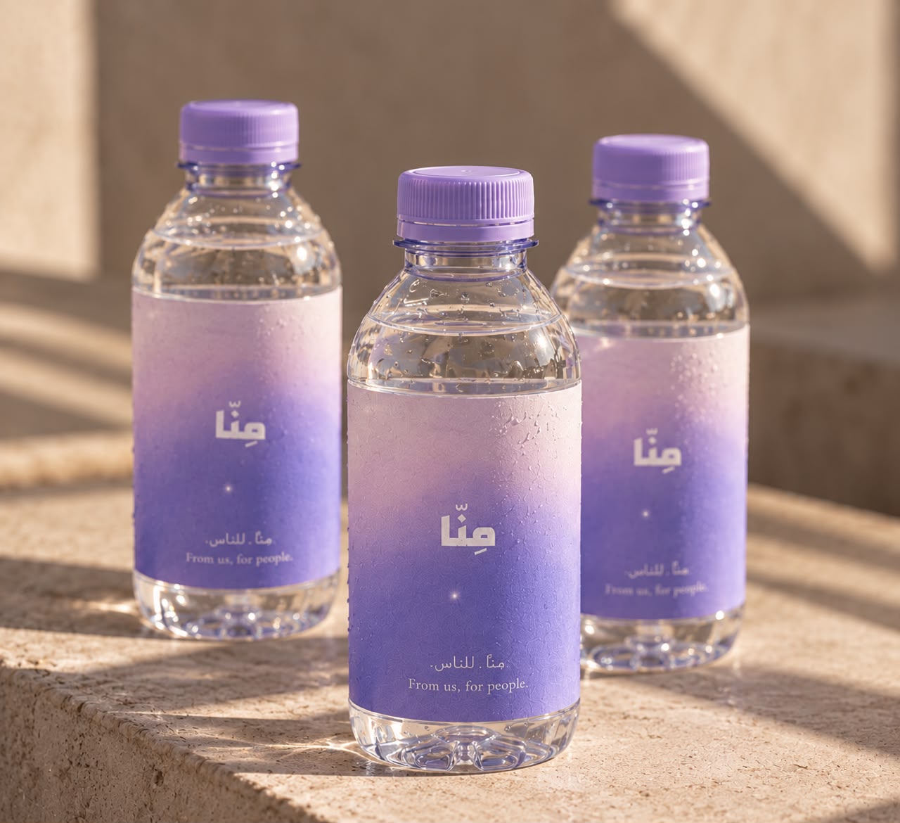 Three MINNA water bottles standing in afternoon light